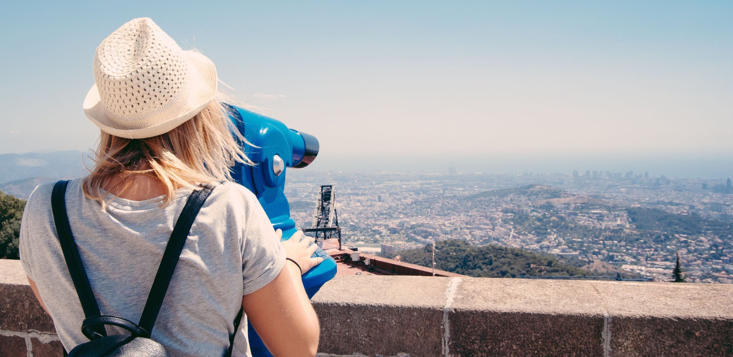 woman-looking-through-binoculars